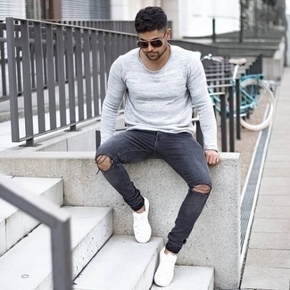 Grey Ripped Skinny Jeans Outfits For Men: A grey long sleeve t-shirt and grey ripped skinny jeans are a good combo worth incorporating into your off-duty collection. For something more on the classier side to complete your outfit, complete your ensemble with a pair of white canvas low top sneakers.
