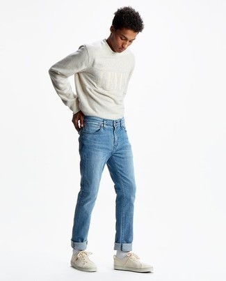 Grey Embroidered Long Sleeve T-Shirt Outfits For Men: For a cool and casual outfit, dress in a grey embroidered long sleeve t-shirt and light blue jeans — these items play well together. Beige canvas low top sneakers will be a welcome companion for this look.