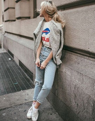 Light Blue Ripped Jeans Outfits For Women: If you love classic pairings, then you'll appreciate this combo of a grey open cardigan and light blue ripped jeans. When not sure about what to wear in the footwear department, complete your look with white low top sneakers.
