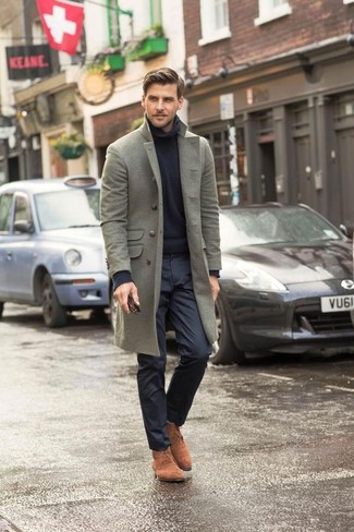 This look proves it is totally worth investing in such smart menswear items as a grey overcoat and black dress pants. Our favorite of a multitude of ways to finish this getup is with tan suede desert boots.