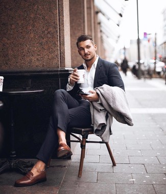 Charcoal Herringbone Overcoat Outfits: Opt for a charcoal herringbone overcoat and a charcoal suit to exude class and sophistication. Brown leather loafers look wonderful rounding off this look.