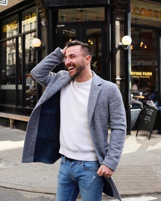 White Crew-neck Sweater Cold Weather Outfits For Men: Consider teaming a white crew-neck sweater with blue ripped skinny jeans for a laid-back ensemble with an urban take.