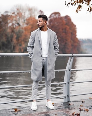 Grey Overcoat Outfits: This combo of a grey overcoat and grey chinos is proof that a simple outfit can still be really interesting. Take an otherwise mostly dressed-up ensemble in a less formal direction by slipping into a pair of white leather low top sneakers.