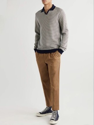 Grey Polo Neck Sweater Outfits For Men: Get into dapper mode in a grey polo neck sweater and khaki chinos. Infuse a dressed-down feel into this look by rounding off with navy and white canvas high top sneakers.