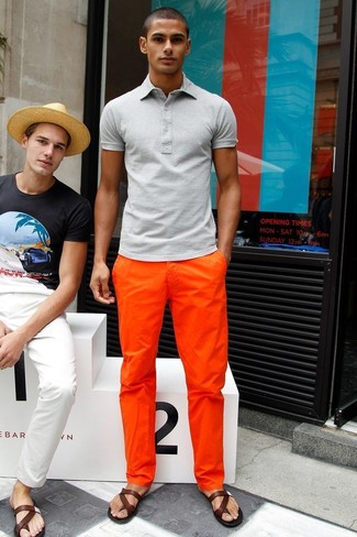 Charcoal Polo Outfits For Men: This casual combination of a charcoal polo and orange chinos is a foolproof option when you need to look dapper in a flash. Our favorite of a variety of ways to round off this getup is a pair of dark brown leather sandals.