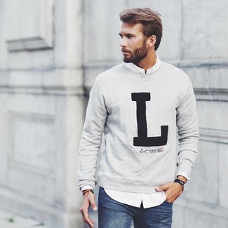 Grey Print Crew-neck Sweater Outfits For Men: For a laid-back and cool look, dress in a grey print crew-neck sweater and navy jeans — these two items work really well together.