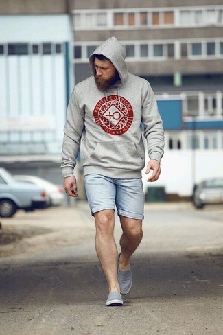 Grey Slip-on Sneakers Outfits For Men: A grey print hoodie and light blue denim shorts are amazing menswear essentials to add to your current repertoire. A good pair of grey slip-on sneakers is the most effective way to give a dash of class to this ensemble.