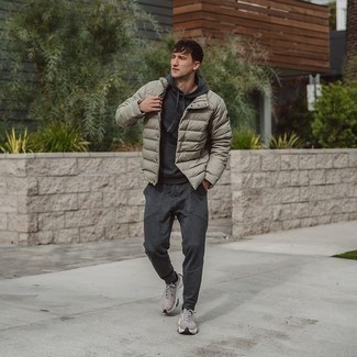 Charcoal Track Suit Outfits For Men: This relaxed casual combo of a charcoal track suit and a grey lightweight puffer jacket is very easy to pull together without a second thought, helping you look amazing and prepared for anything without spending a ton of time searching through your wardrobe. Display your fun side by rounding off with grey athletic shoes.