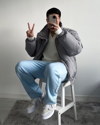 Light Blue Chinos Outfits: Such essentials as a grey puffer jacket and light blue chinos are an easy way to infuse some rugged sophistication into your casual styling arsenal. Let your styling prowess really shine by complementing this look with a pair of grey suede low top sneakers.