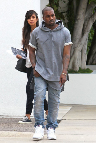 Kanye West wearing Grey Short Sleeve Hoodie, Grey Crew-neck T-shirt, Light Blue Jeans, White Athletic Shoes