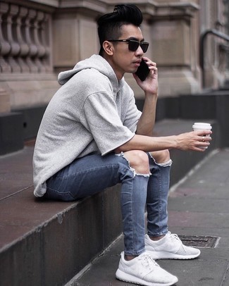 White and Blue Athletic Shoes Outfits For Men: For something more on the casual end, marry a grey short sleeve hoodie with navy ripped skinny jeans. For maximum fashion effect, complete your ensemble with a pair of white and blue athletic shoes.