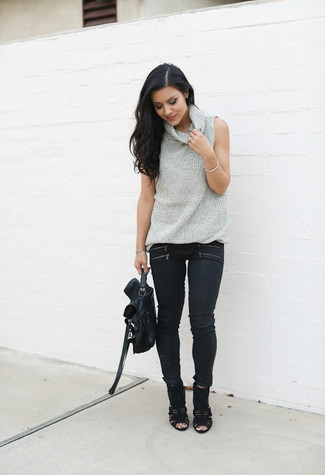 Grey Sleeveless Turtleneck Outfits: This pairing of a grey sleeveless turtleneck and black skinny jeans is definitive proof that a straightforward off-duty outfit can still be absolutely chic. And if you need to easily kick up this outfit with a pair of shoes, why not complement your outfit with black cutout suede ankle boots?