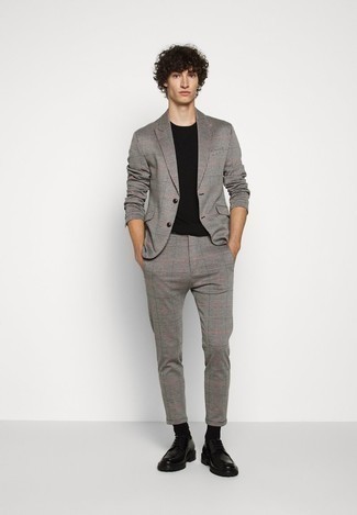 Grey Check Suit Outfits: Show that you do semi-casual men's fashion like a pro by opting for a grey check suit and a black crew-neck t-shirt. Why not complement this look with black chunky leather derby shoes for an added touch of style?