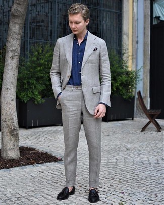Grey Linen Suit Outfits: Consider wearing a grey linen suit and a navy dress shirt - this look will definitely make an entrance. Want to play it down on the shoe front? Complete this ensemble with black woven leather tassel loafers for the day.