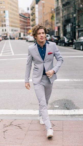 Grey Check Suit Outfits: Wear a grey check suit and a navy long sleeve shirt to put together a casually classic and well-executed outfit. Finishing with a pair of white low top sneakers is an easy way to introduce a laid-back vibe to your ensemble.