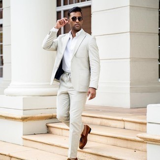 Charcoal Suit with White Dress Shirt Outfits: For a look that's elegant and camera-worthy, try teaming a charcoal suit with a white dress shirt. If you want to instantly dress down this outfit with one single item, introduce a pair of brown suede tassel loafers to the equation.