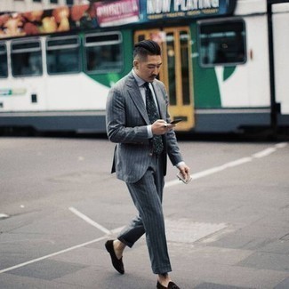 Olive Print Tie Outfits For Men: Consider wearing a grey vertical striped suit and an olive print tie - this look is bound to make heads turn. Dark brown suede loafers are guaranteed to bring a dash of stylish nonchalance to this ensemble.