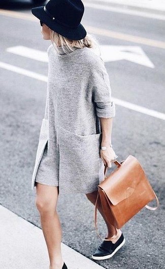 Black Leather Slip-on Sneakers Outfits For Women: Make a grey sweater dress your outfit choice for an off-duty and fashionable ensemble. A pair of black leather slip-on sneakers easily revs up the fashion factor of your look.