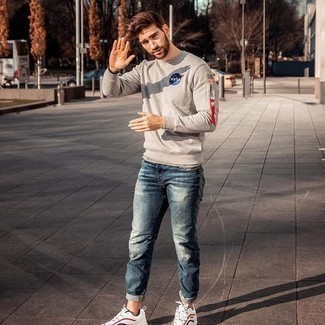 Charcoal Sweatshirt Outfits For Men: This combo of a charcoal sweatshirt and blue jeans is proof that a straightforward off-duty look can still look extra dapper. Add a more informal twist to this look by sporting a pair of white and red and navy athletic shoes.