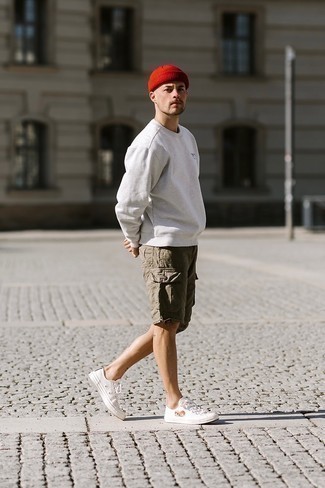 Shorts Outfits For Men: For a surefire casual option, you can rely on this pairing of a grey sweatshirt and shorts. On the shoe front, this look is complemented really well with white print canvas low top sneakers.