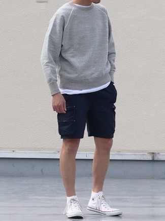 Charcoal Sweatshirt Outfits For Men: For a casually cool ensemble, pair a charcoal sweatshirt with navy shorts — these two items work beautifully together. A pair of white canvas high top sneakers instantly turns up the wow factor of this ensemble.
