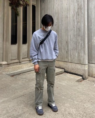 1200+ Outfits For Men In Their Teens: Why not reach for a grey sweatshirt and olive cargo pants? These two pieces are very practical and look awesome combined together. Consider charcoal canvas low top sneakers as the glue that will bring your outfit together. As a teen, you're guaranteed to love this look.