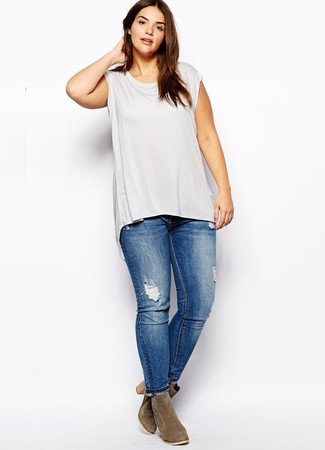 Blue Ripped Skinny Jeans Outfits: This combo of a grey tank and blue ripped skinny jeans delivers comfort and confidence and helps you keep it clean yet trendy. Introduce olive suede ankle boots to the mix to easily up the chic factor of your getup.