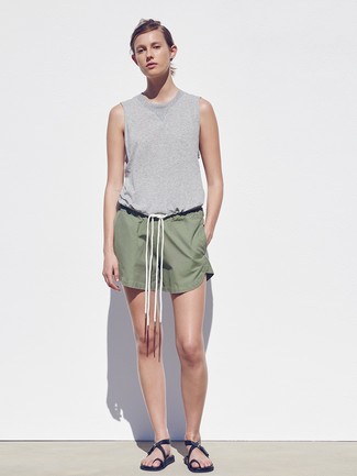 Black Leather Flat Sandals Outfits: This pairing of a grey tank and olive shorts combines comfort and utility and helps you keep it low profile yet contemporary. Black leather flat sandals are an easy way to infuse a sense of casualness into this outfit.