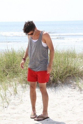 Flip Flops Outfits For Men: This combination of a grey tank and red shorts is put together and yet it's easy and apt for anything. Finishing off with flip flops is a simple way to infuse a more laid-back twist into your look.