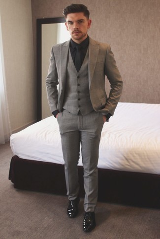 Black Tie Outfits For Men: Choose a grey plaid three piece suit and a black tie for a sharp and sophisticated silhouette. Go ahead and complement your look with black leather derby shoes for a more casual touch.