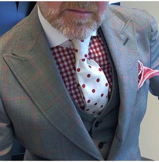 Red Polka Dot Tie Outfits For Men: This refined pairing of a grey check three piece suit and a red polka dot tie will prove your sartorial skills.