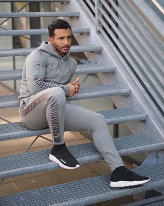 Grey Track Suit Outfits For Men: Dress in a grey track suit to feel 100% confident and look on-trend. For extra fashion points, complete your getup with a pair of black and white athletic shoes.