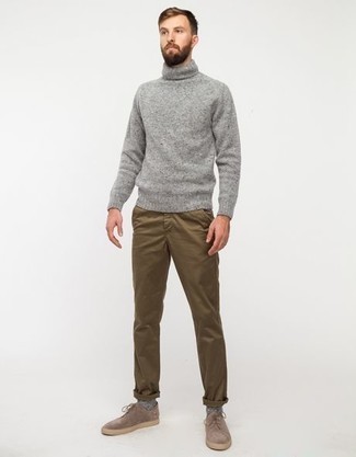 Charcoal Wool Turtleneck Outfits For Men: This pairing of a charcoal wool turtleneck and brown chinos looks well-executed and instantly makes you look cool. Why not add tan suede derby shoes to this look for an extra touch of polish?