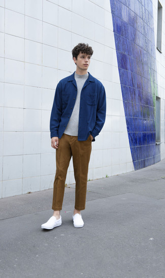 White Canvas Slip-on Sneakers Outfits For Men: This combination of a grey turtleneck and brown chinos is simple, dapper and very easy to copy. Complete this look with a pair of white canvas slip-on sneakers and you're all done and looking awesome.