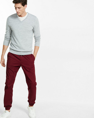 Burgundy Chinos with White Leather Low Top Sneakers Spring Outfits: If you want to feel confident in your ensemble, dress in a grey v-neck sweater and burgundy chinos. You can go down a more casual route on the shoe front with white leather low top sneakers. Keep this outfit in your front hall wardrobe when spring sets it, and we promise you'll save a lot of time brainstorming for a look on more than one occasion.