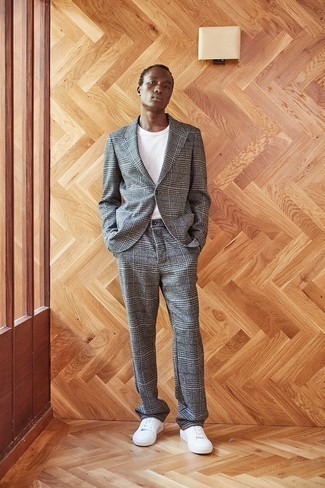 Charcoal Plaid Wool Suit Outfits: A charcoal plaid wool suit and a white crew-neck t-shirt are totally worth adding to your list of veritable menswear staples. You could stick to the casual route on the shoe front by finishing off with a pair of white canvas low top sneakers.