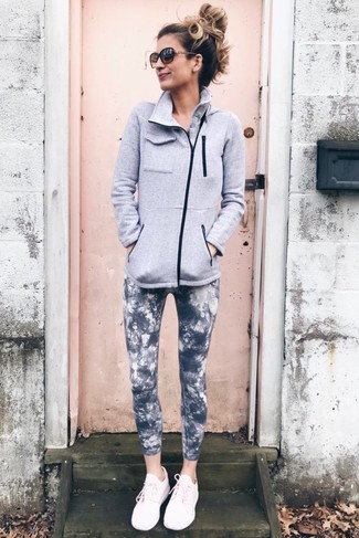 500+ Relaxed Outfits For Women: A grey fleece zip sweater and charcoal tie-dye leggings are absolute must-haves if you're putting together an off-duty wardrobe that holds to the highest sartorial standards. To infuse an element of stylish nonchalance into your getup, complement your outfit with a pair of pink athletic shoes.