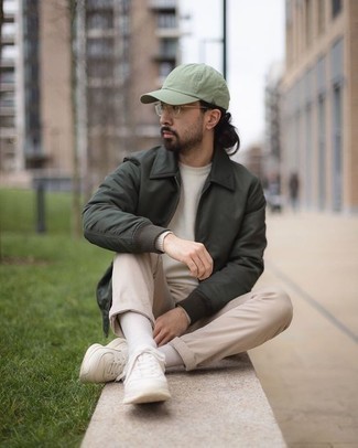 Mint Baseball Cap Outfits For Men: This relaxed combo of a dark green harrington jacket and a mint baseball cap is very easy to pull together in no time flat, helping you look seriously stylish and prepared for anything without spending too much time searching through your wardrobe. A pair of white athletic shoes is a fail-safe footwear style that's also full of character.