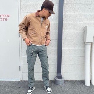 Tan Harrington Jacket Outfits: This pairing of a tan harrington jacket and mint cargo pants is indisputable proof that a simple casual outfit doesn't have to be boring. Introduce white and black leather low top sneakers to the mix et voila, the outfit is complete.