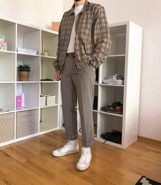 Brown Chinos Outfits: A tan plaid harrington jacket and brown chinos? This is an easy-to-wear ensemble that anyone can wear a variation of on a day-to-day basis. Throw in white leather low top sneakers et voila, your getup is complete.