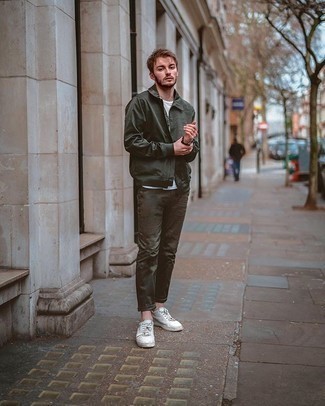 Dark Green Harrington Jacket Outfits: A dark green harrington jacket and dark green chinos are a good pairing to add to your daily outfit choices. White canvas low top sneakers can instantly tone down a classic look.