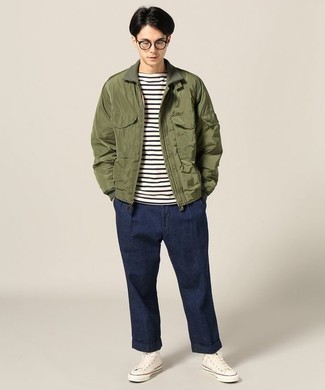 Olive Harrington Jacket Outfits: An olive harrington jacket and navy chinos are the kind of a never-failing casual ensemble that you so terribly need when you have no time to spare. Up this whole ensemble by rocking white canvas high top sneakers.