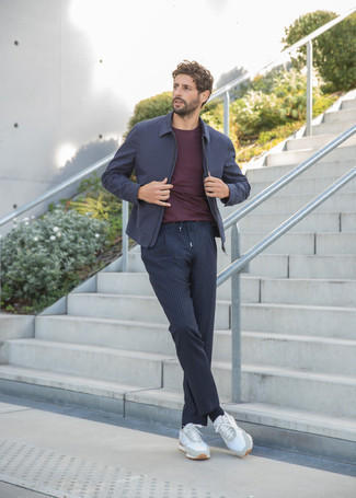 Navy Harrington Jacket Outfits: Consider wearing a navy harrington jacket and navy vertical striped chinos for a relaxed outfit with a modern take. Clueless about how to finish? Complement this ensemble with a pair of white athletic shoes to shake things up.