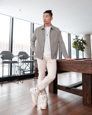 Charcoal Harrington Jacket Outfits: This combo of a charcoal harrington jacket and beige jeans is proof that a pared down casual look doesn't have to be boring. Beige canvas low top sneakers are a nice choice to complete this ensemble.