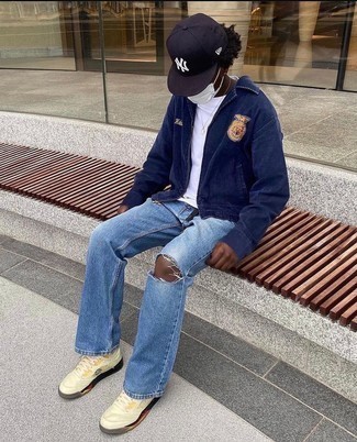 Beige Canvas High Top Sneakers Outfits For Men: Go for a pared down yet casually stylish choice by marrying a navy embroidered harrington jacket and light blue ripped jeans. The whole look comes together when you throw in beige canvas high top sneakers.