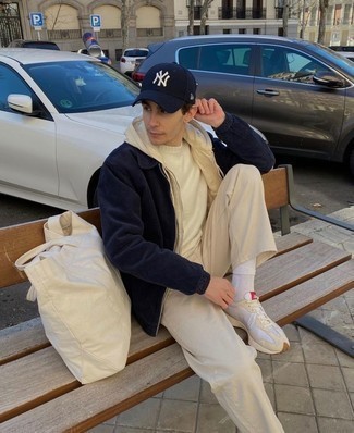 Beige Canvas Tote Bag Outfits For Men: This combo of a navy corduroy harrington jacket and a beige canvas tote bag is a safe go-to for an effortlessly dapper getup. Beige athletic shoes will be the ideal complement to this ensemble.