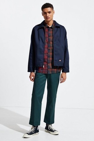 Red Plaid Flannel Long Sleeve Shirt Outfits For Men: Swing into something casual yet on-trend with a red plaid flannel long sleeve shirt and dark green chinos. Let your styling sensibilities truly shine by complementing this outfit with a pair of black and white canvas high top sneakers.