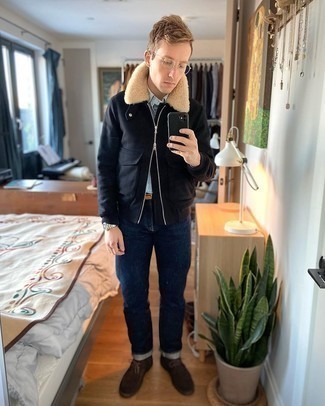 Dark Brown Suede Desert Boots Outfits: A black harrington jacket and navy jeans are a combination that every trendsetting guy should have in his menswear collection. Complement this look with a pair of dark brown suede desert boots for extra fashion points.