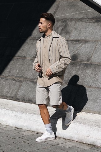 Shorts Outfits For Men: Dress in a beige harrington jacket and shorts for a fuss-free getup that's also put together. The whole getup comes together quite nicely if you complement your look with white canvas low top sneakers.