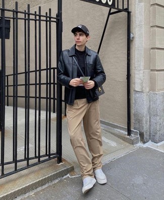 Black Leather Harrington Jacket Outfits: This combo of a black leather harrington jacket and khaki chinos is a safe go-to for an effortlessly cool outfit. Why not complement this outfit with a pair of white canvas low top sneakers for a playful touch?